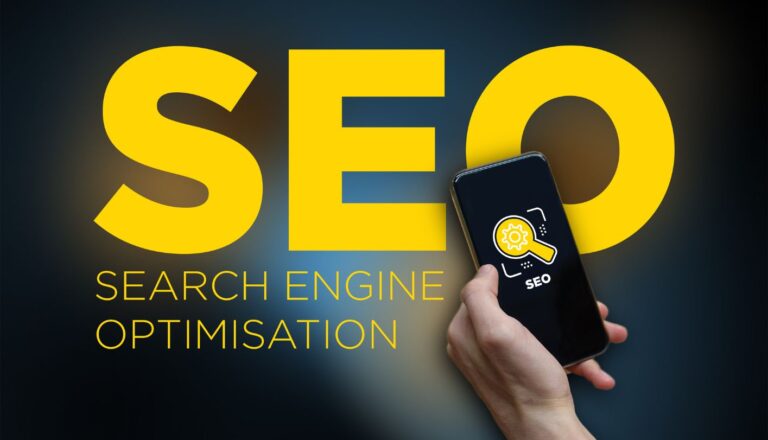 Person holding a cell phone and the words SEO - Search Engine Optimization by KVT Design