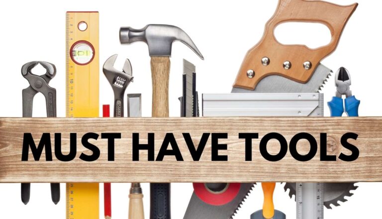 Multiple tools like hammer, saw, ruler, etc with a piece of wood laying across the tools with the words Must Have Tools needed for Graphic Design